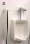QR code above urinal